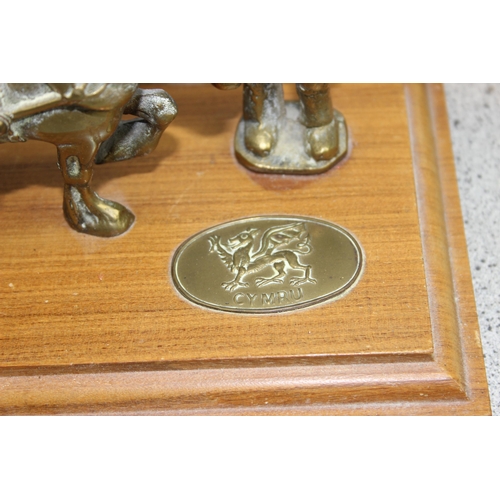 1790 - A vintage Welsh brass model of a coal miner and pit pony on wooden base