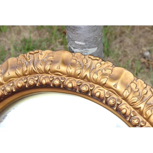 448 - A large vintage gilt framed convex mirror