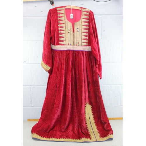 223 - An antique red velvet dress with heavy gold thread embroidery, possibly Turkish