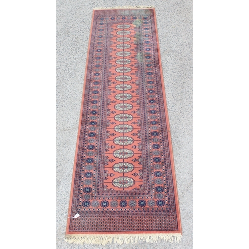 220 - A large decorative hall runner rug, approx 360cm x 90cm