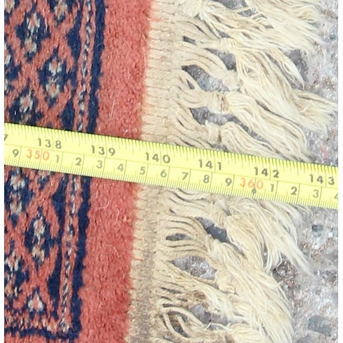 220 - A large decorative hall runner rug, approx 360cm x 90cm