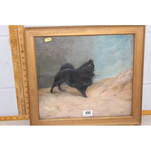 490 - An antique oil painting on canvas of a dog of a small black dog, initialled HW lower left, framed an... 