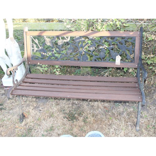 389 - Wooden slatted garden bench with metal ends and floral back