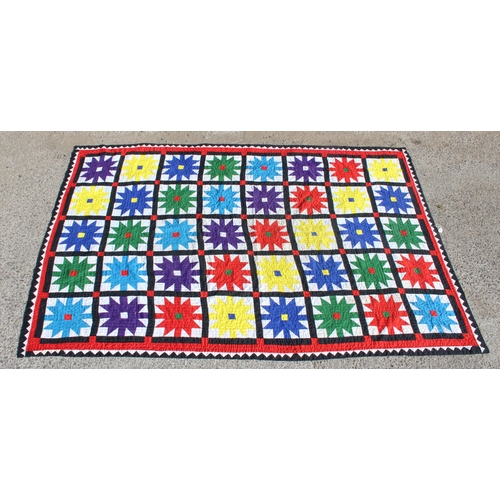 222a - A large vintage multicoloured African patchwork quilt