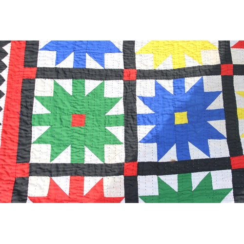 222a - A large vintage multicoloured African patchwork quilt