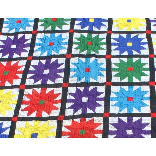 222a - A large vintage multicoloured African patchwork quilt