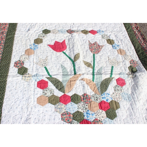 222b - A large vintage patchwork quilt decorated with flowers by Home Tex of Guernsey