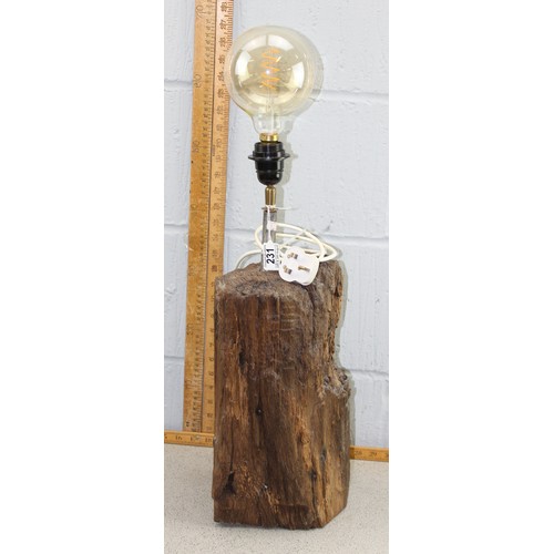 231 - A rustic wooden table lamp with unusual bulb