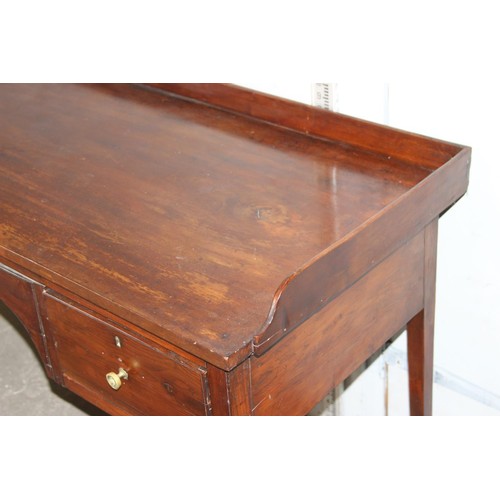 147 - A 19th century yew-wood and mahogany sideboard, with galleried top, two frieze drawers, 3’11” wide