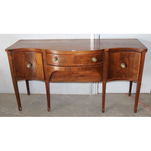 148 - A George III mahogany serpentine sideboard cross banded in kingwood, with central drawer and conceal... 