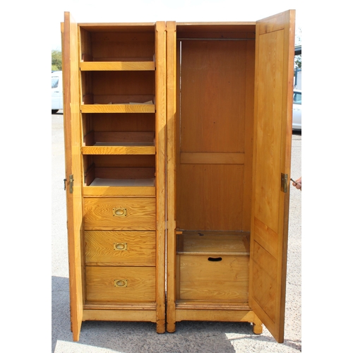 1 - A large vintage pine wardrobe with gothic style strapwork hinges, the interior containing shelves an... 