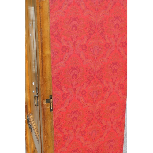 1 - A large vintage pine wardrobe with gothic style strapwork hinges, the interior containing shelves an... 