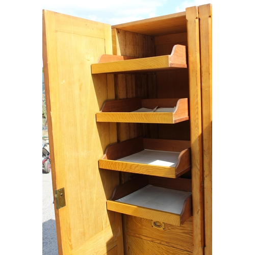 1 - A large vintage pine wardrobe with gothic style strapwork hinges, the interior containing shelves an... 