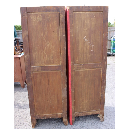 1 - A large vintage pine wardrobe with gothic style strapwork hinges, the interior containing shelves an... 