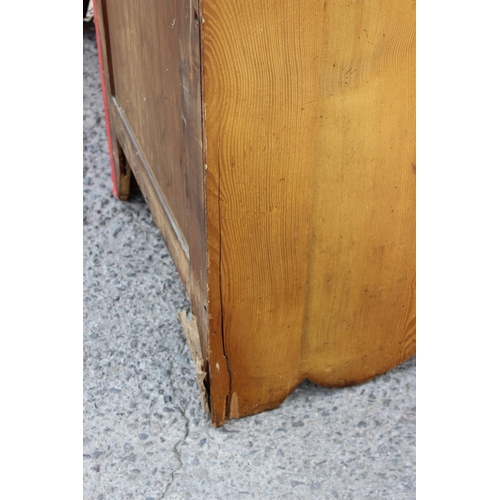 1 - A large vintage pine wardrobe with gothic style strapwork hinges, the interior containing shelves an... 