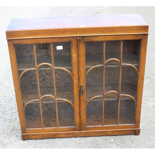 11 - Art Deco period glazed oak bookcase with cloud effect design