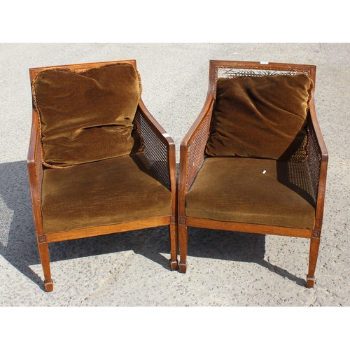 13 - A pair of Edwardian Regency revival style Bergere armchairs with cushions