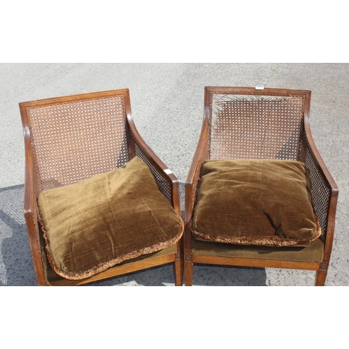 13 - A pair of Edwardian Regency revival style Bergere armchairs with cushions