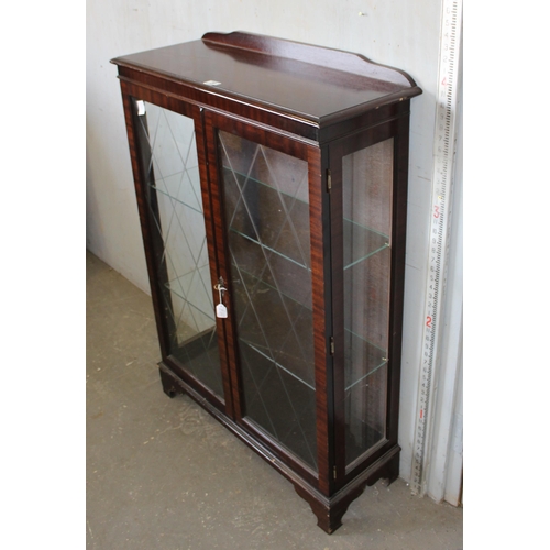 20 - Mahogany glazed display cabinet, with key and glass shelves