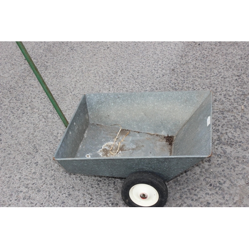 253 - An unusual low galvanised vintage wheelbarrow