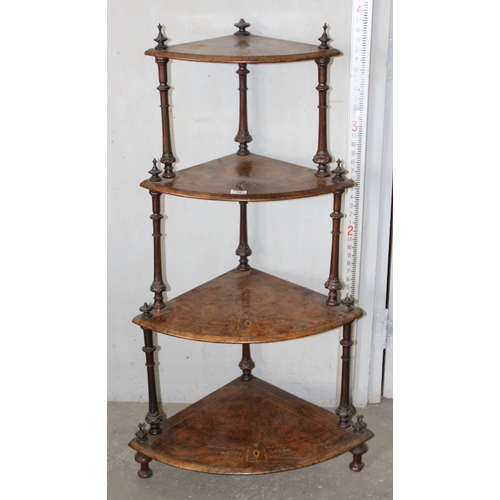 32 - An antique walnut veneered 4-tiered whatnot