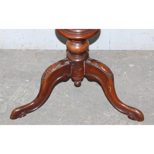 33 - An antique walnut trumpet shaped sewing table