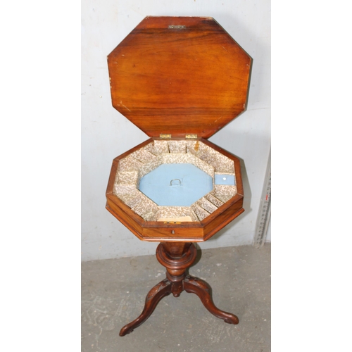 33 - An antique walnut trumpet shaped sewing table