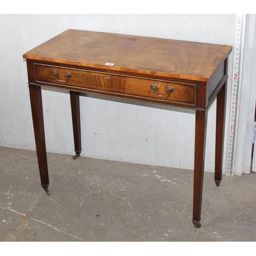 49 - A 20th century mahogany console table with single drawer