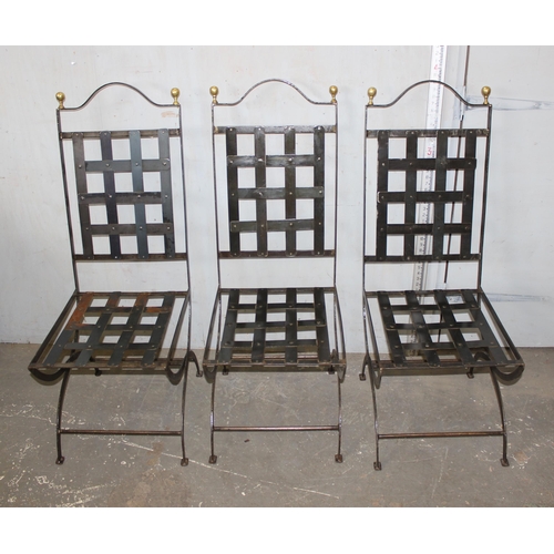 56 - A set of 6 wrought iron chairs with suede cushions and brass pommels