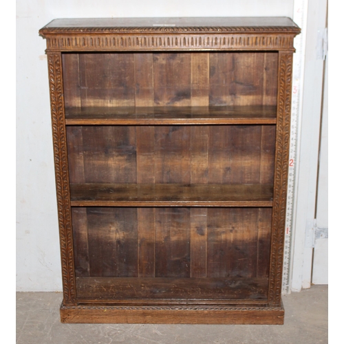 58 - A vintage carved oak book case