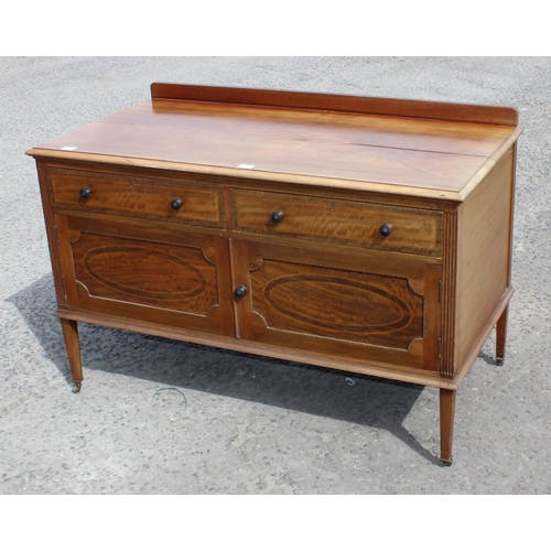 9 - An early 20th century mahogany sideboard or side cabinet with brass castors