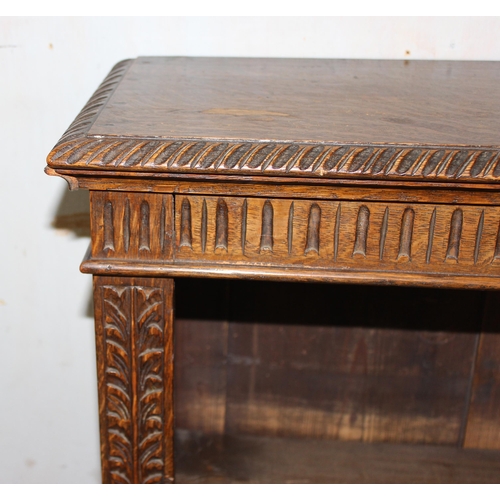 58 - A vintage carved oak book case