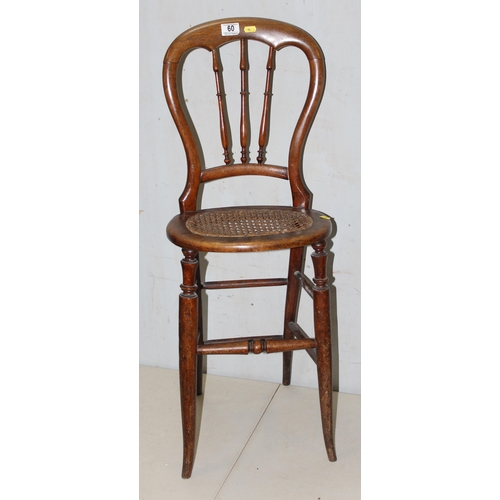 60 - An antique child's high chair with bergere seat