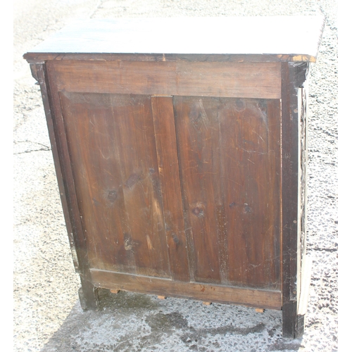 102 - An antique carved dark oak bookcase in the Jacobean style, approx 110cm tall x 94cm wide