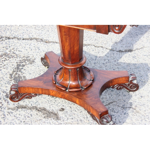 108 - A 19th century mahogany fold over card table with pedestal support