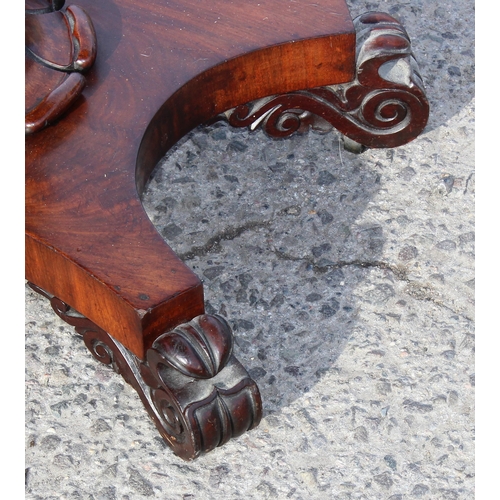 108 - A 19th century mahogany fold over card table with pedestal support