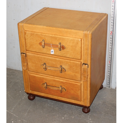 80 - An unusual leather clad 3 drawer chest of drawers, possibly retailed by Harrods