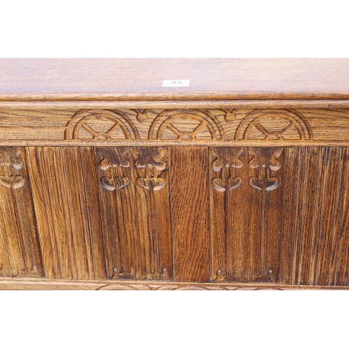 83 - A small vintage oak coffer with carved details