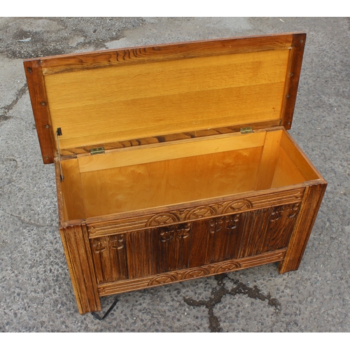 83 - A small vintage oak coffer with carved details