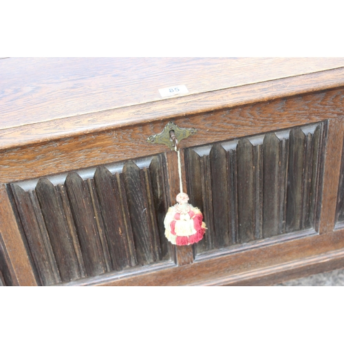 85 - A larger vintage oak coffer with key