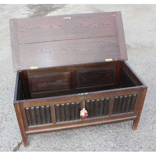 85 - A larger vintage oak coffer with key