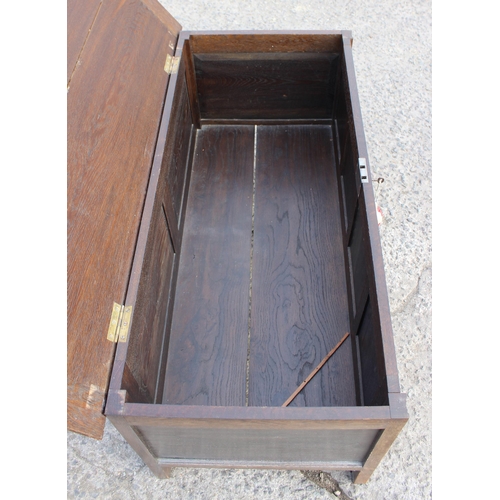 85 - A larger vintage oak coffer with key