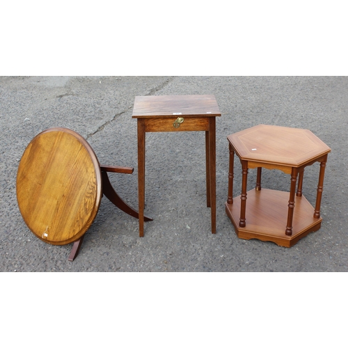 89 - A small oak table with brass fittings, modern hexagonal table and a low round topped oak table