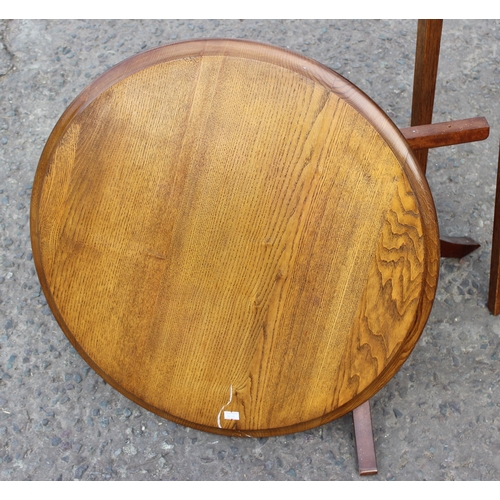 89 - A small oak table with brass fittings, modern hexagonal table and a low round topped oak table