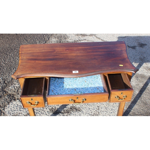 99 - A small antique 3 drawer mahogany writing desk