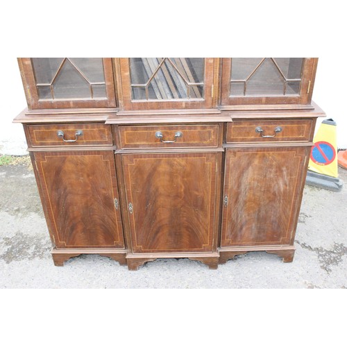 78 - A large Mahogany breakfront bookcase