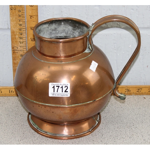 1712 - A vintage copper jug with brass armorial crest