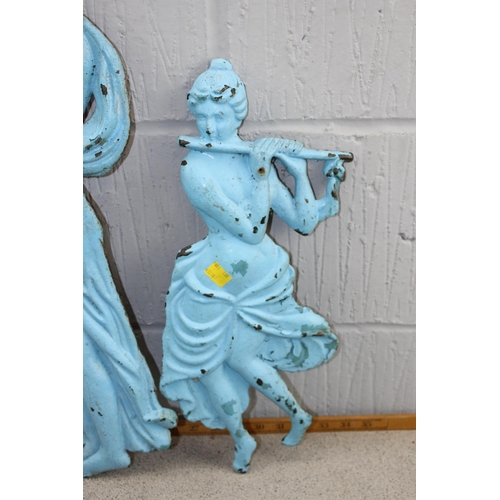 1719 - A trio of unusual antique painted cast iron wall plaques depicting classical female figures, the lar... 