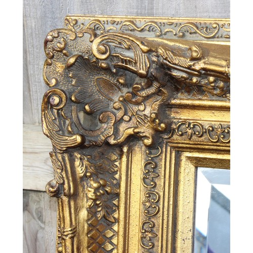 302 - A large antique style gilt framed wall mirror