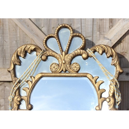 301 - A large gilt framed Rococo style wall mirror